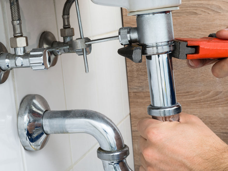 handyman working on a toilet